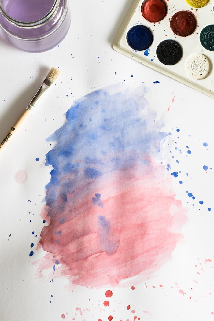 services-01 Vibrant watercolor painting with blue and red gradient, brush, and palette.